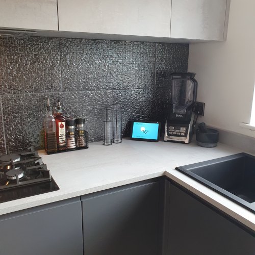 U shaped space with a handleless grey kitchen door and a faux concrete kitchen door with concrete effect worktop