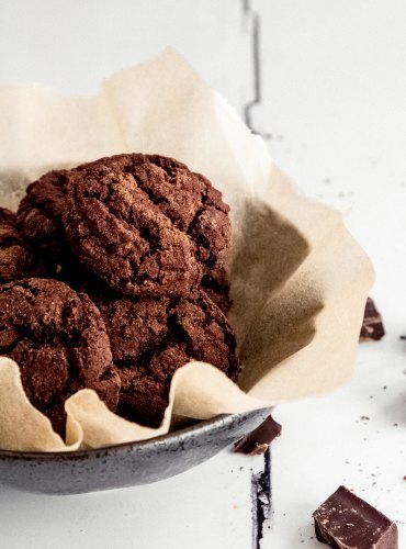 Chocolate Cookies made by peter sidwell in a metal bowl with brown parchment paper