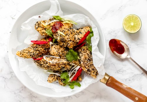 chicken strips with sesame seeds and chillies in a pan cooked by peter sidwell